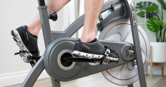 a person is cycling at home