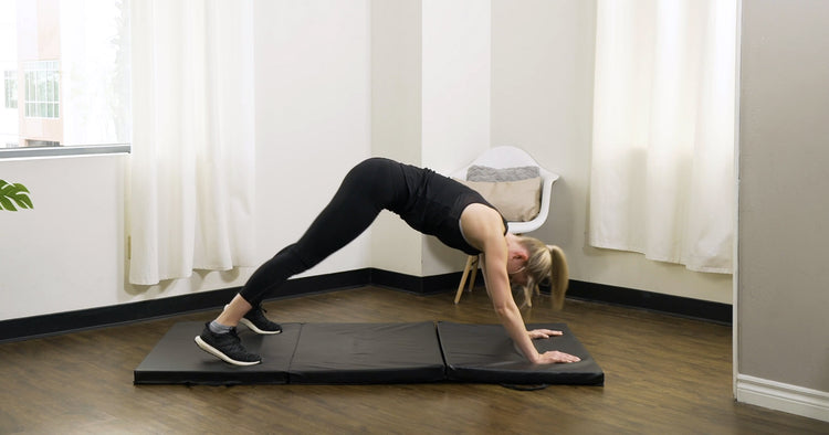 Sunny trainer doing office break exercises