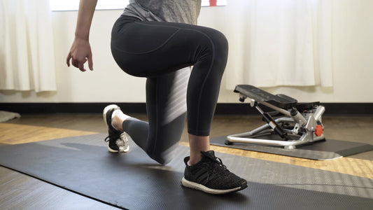 Sunny trainer exercising with mini steppers