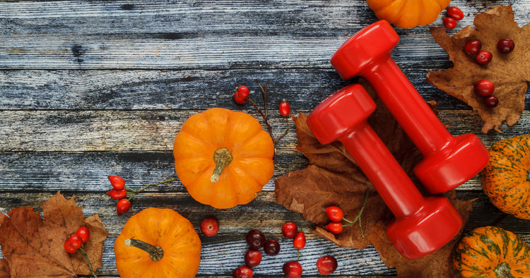 a pair of dumbbells with pumpkins