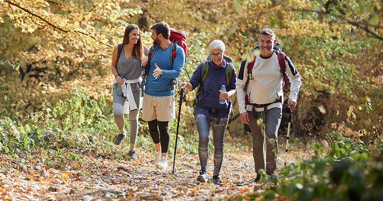 Group of people doing outdoor workouts - hiking