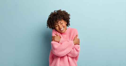 a lady hugging herself