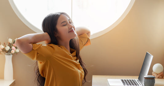 A student stretching after studying