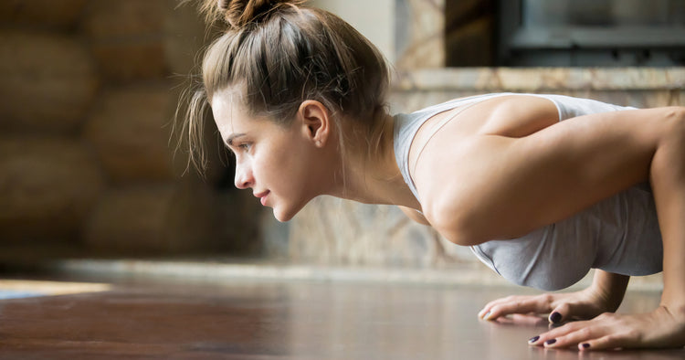 a woman is pushing up