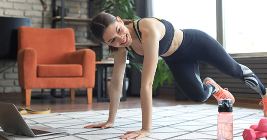 a lady is doing mountain climbing exercise