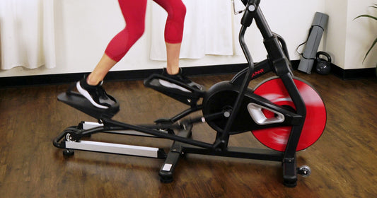 a woman is riding elliptical