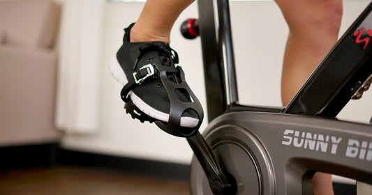 a person is pedaling a Sunny cycle bike