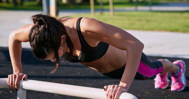 a woman is pushing up
