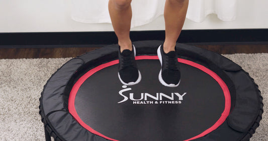 a woman is jumping on trampoline