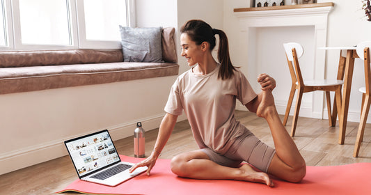 a lady is stretching at home