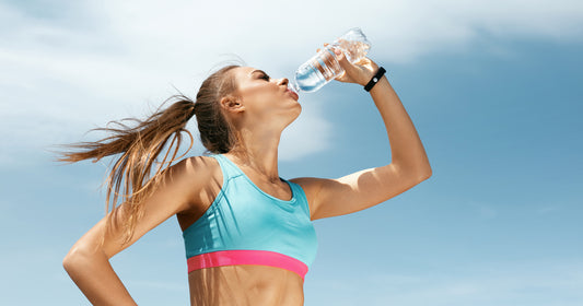 a woman is drinking water