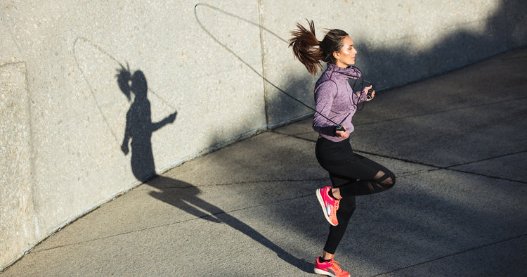 a woman is jumping rope