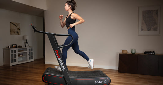 Woman enjoying the benefits of a manual treadmill exercise