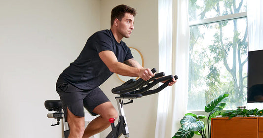 a man is cycling with a pad on device holder