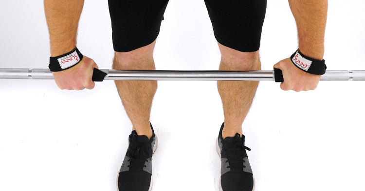 a man is using lifting wrist straps