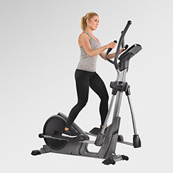 woman exercising on elliptical machine