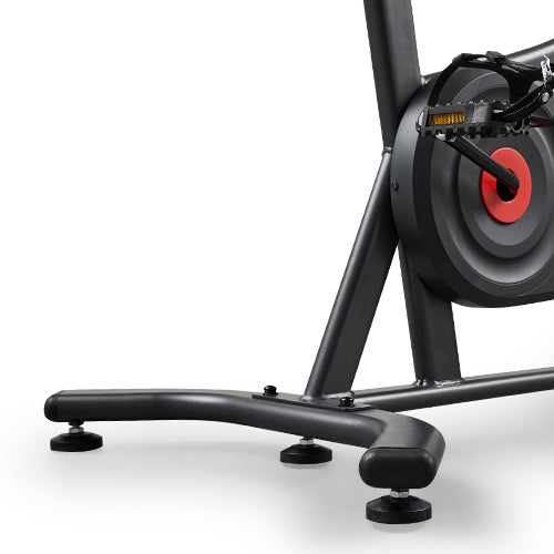 Micro-Adjustable Floor Stabilizers | Each foot twists individually to match uneven surfaces—giving your bike a firm, balanced grip on almost any floor.